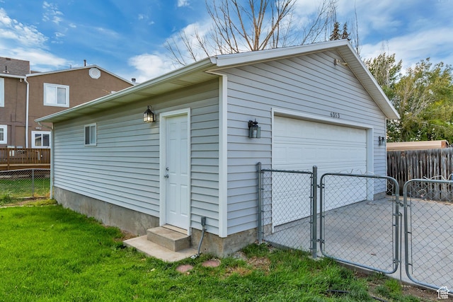 6353 W 3100 S, West Valley City, UT 84128 - detached garage featuring a gate