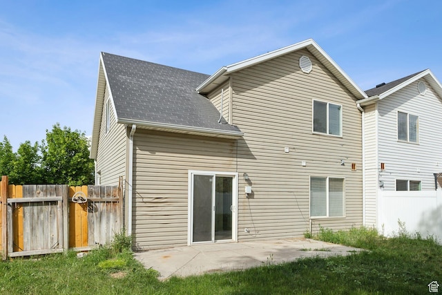 256 Jay Ln, Payson, UT 84651 - back of property featuring a shingled roof, a gate, and a patio