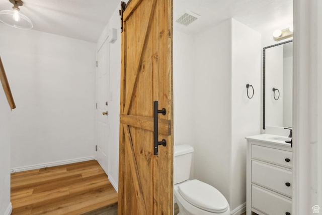 256 Jay Ln, Payson, UT 84651 - half bath featuring vanity, toilet, wood finished floors, and baseboards