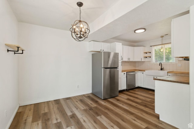 256 Jay Ln, Payson, UT 84651 - kitchen with stainless steel appliances, a sink, dark wood-style floors, and decorative backsplash