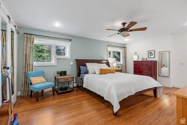 971 E Village Way, Alpine, UT 84004 - bedroom featuring multiple windows, light wood-style floors, recessed lighting, a ceiling fan, and baseboards
