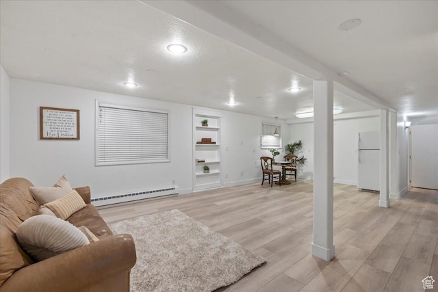 971 E Village Way, Alpine, UT 84004 - living area featuring a baseboard radiator, built in features, baseboards, and light wood-type flooring