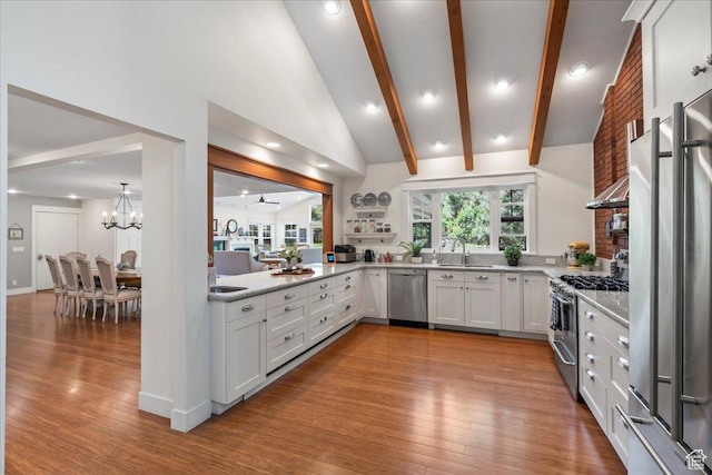 971 E Village Way, Alpine, UT 84004 - kitchen featuring high end appliances, wood finished floors, a sink, a chandelier, and white cabinets