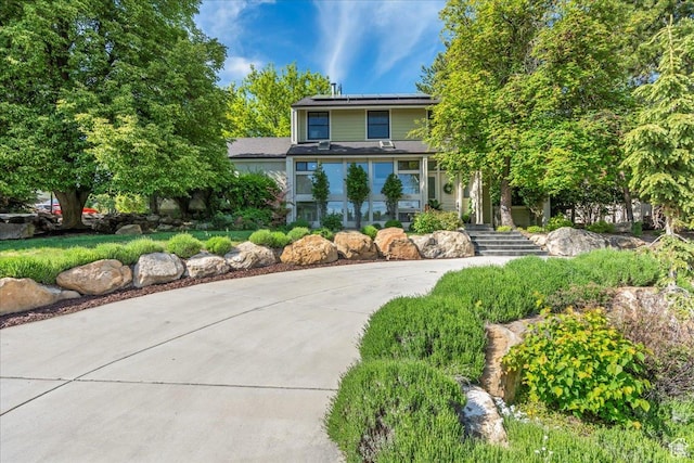 971 E Village Way, Alpine, UT 84004 - view of property hidden behind natural elements featuring solar panels and concrete driveway