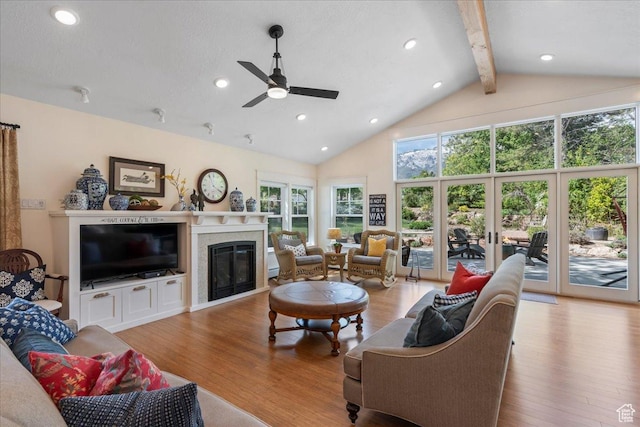 971 E Village Way, Alpine, UT 84004 - living room featuring beamed ceiling, wood finished floors, ceiling fan, a premium fireplace, and high vaulted ceiling