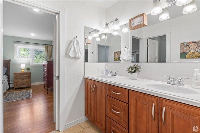 971 E Village Way, Alpine, UT 84004 - full bathroom with double vanity, ensuite bathroom, baseboards, and a baseboard heating unit