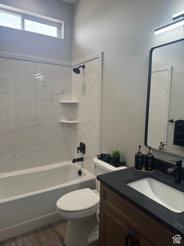 565 E Otto Ln Unit 421, Grantsville, UT 84029 - bathroom with vanity, toilet, wood finished floors, and shower / bath combination