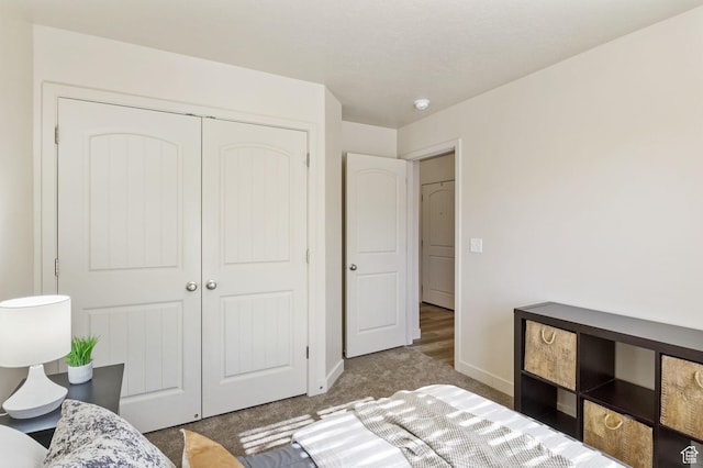 1135 Surrey Dr, North Salt Lake, UT 84054 - carpeted bedroom with baseboards and a closet