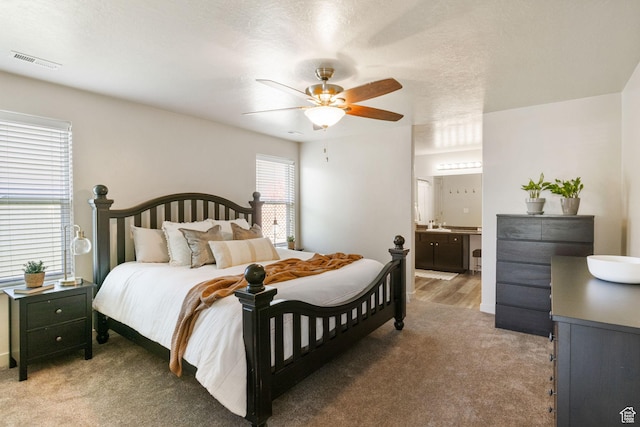 1135 Surrey Dr, North Salt Lake, UT 84054 - bedroom featuring light carpet, ensuite bath, and ceiling fan