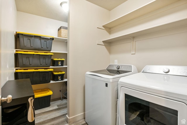 1135 Surrey Dr, North Salt Lake, UT 84054 - washroom featuring separate washer and dryer and wood finished floors