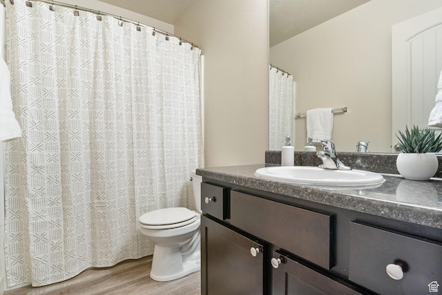 1135 Surrey Dr, North Salt Lake, UT 84054 - full bathroom with vanity, toilet, wood finished floors, and curtained shower