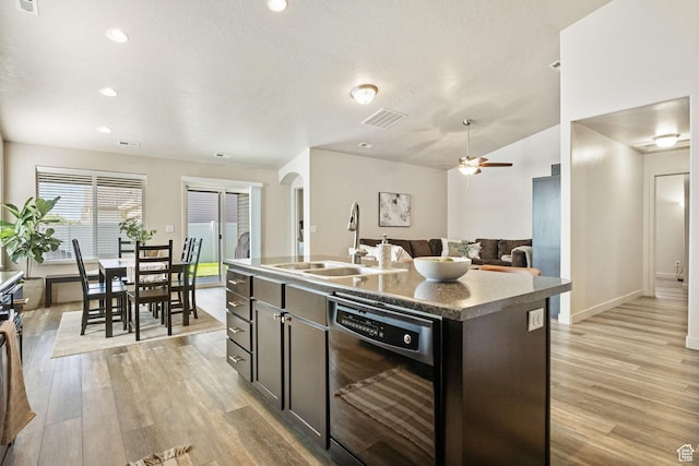 1135 Surrey Dr, North Salt Lake, UT 84054 - kitchen featuring dishwasher, a sink, light wood finished floors, arched walkways, and recessed lighting