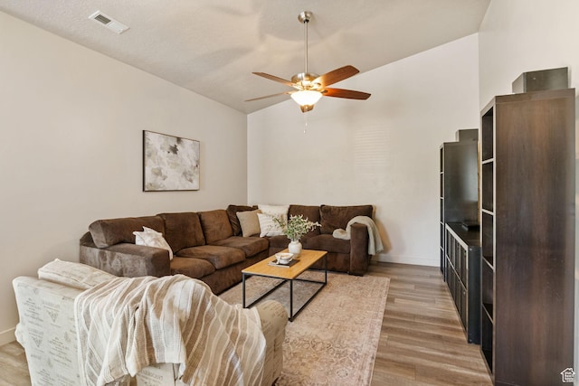 1135 Surrey Dr, North Salt Lake, UT 84054 - living room featuring light wood finished floors, ceiling fan, vaulted ceiling, and baseboards