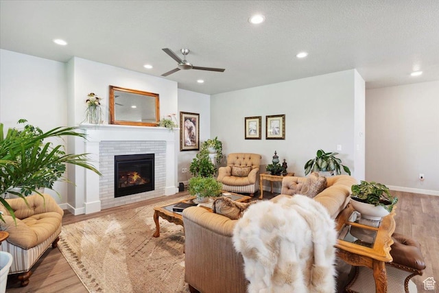 94 N 3830 W, West Point, UT 84015 - living area with a ceiling fan, wood finished floors, recessed lighting, a brick fireplace, and baseboards