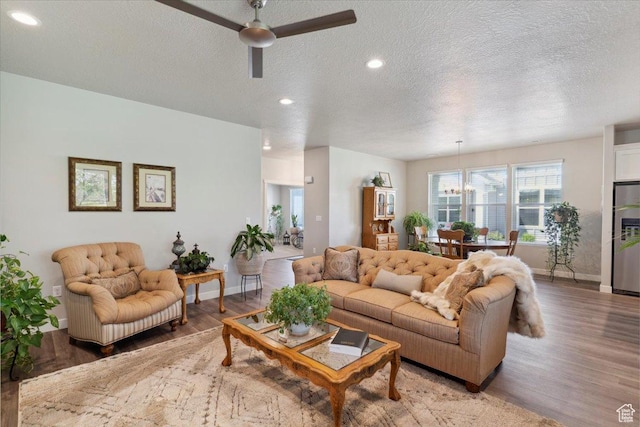 94 N 3830 W, West Point, UT 84015 - living area with light wood finished floors, a textured ceiling, ceiling fan, baseboards, and recessed lighting