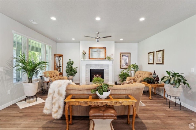 94 N 3830 W, West Point, UT 84015 - living room with baseboards, recessed lighting, wood finished floors, a brick fireplace, and a ceiling fan