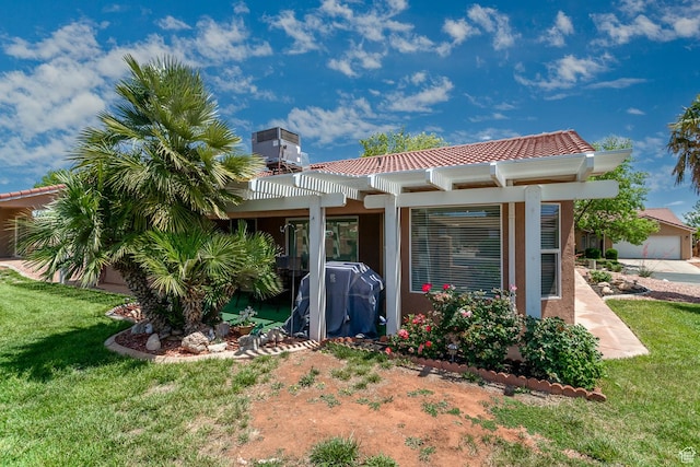 576 S Fiesta Dr, Ivins, UT 84738 - back of property featuring a pergola, a lawn, a tile roof, stucco siding, and central AC unit