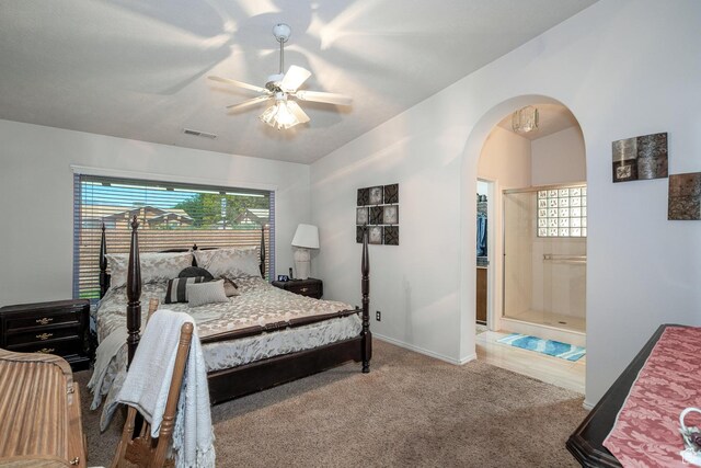 576 S Fiesta Dr, Ivins, UT 84738 - carpeted bedroom featuring arched walkways, a ceiling fan, baseboards, and lofted ceiling