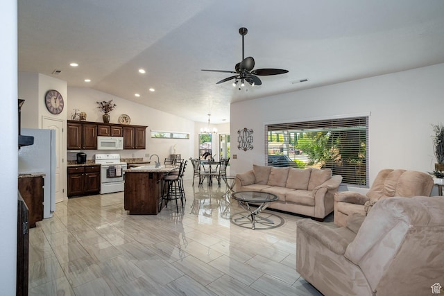 576 S Fiesta Dr, Ivins, UT 84738 - living room with a ceiling fan, recessed lighting, lofted ceiling, and a chandelier