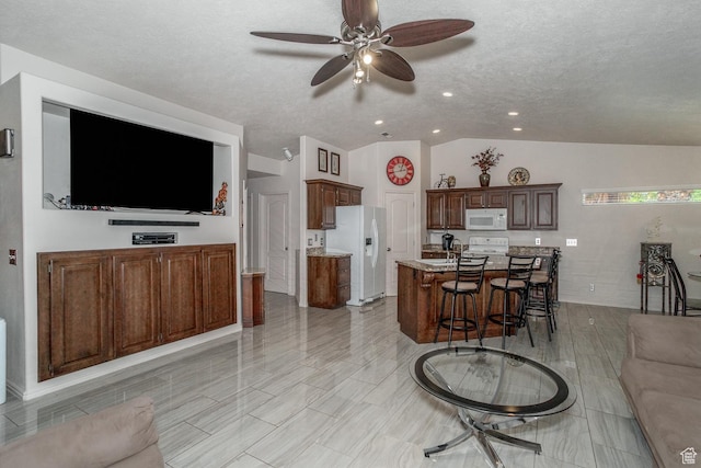 576 S Fiesta Dr, Ivins, UT 84738 - living room featuring ceiling fan, lofted ceiling, a textured ceiling, and recessed lighting