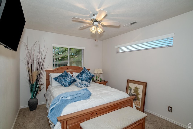 576 S Fiesta Dr, Ivins, UT 84738 - bedroom with light colored carpet, baseboards, and ceiling fan