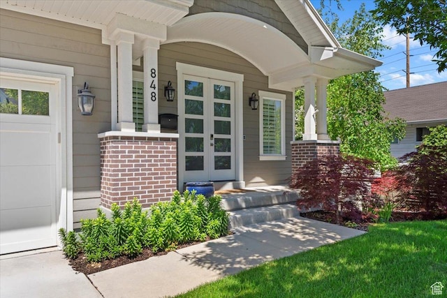 848 S Greenwood Ter E, Salt Lake City, UT 84105 - entrance to property featuring a porch and brick siding