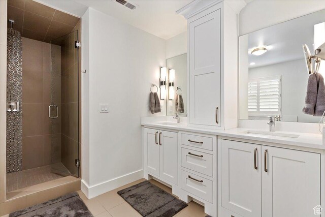 848 S Greenwood Ter E, Salt Lake City, UT 84105 - full bath featuring a stall shower, double vanity, tile patterned floors, and baseboards
