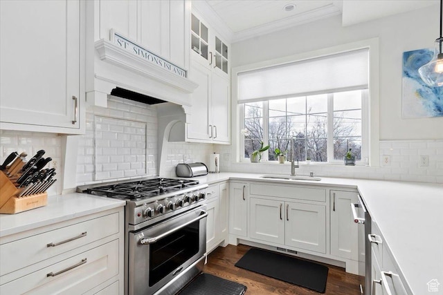 848 S Greenwood Ter E, Salt Lake City, UT 84105 - kitchen with high end stainless steel range oven, ornamental molding, white cabinetry, tasteful backsplash, and light countertops