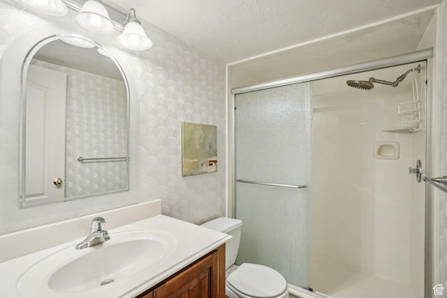 4538 Cottage Grove Ln, Murray, UT 84107 - full bath with wallpapered walls, a shower stall, vanity, toilet, and a textured ceiling
