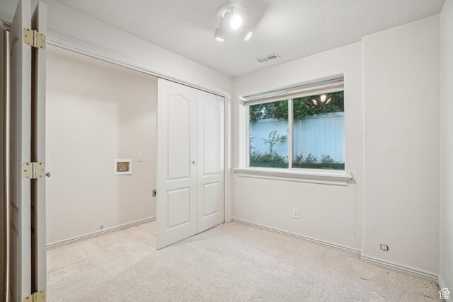4538 Cottage Grove Ln, Murray, UT 84107 - unfurnished bedroom featuring light colored carpet, a closet, and baseboards