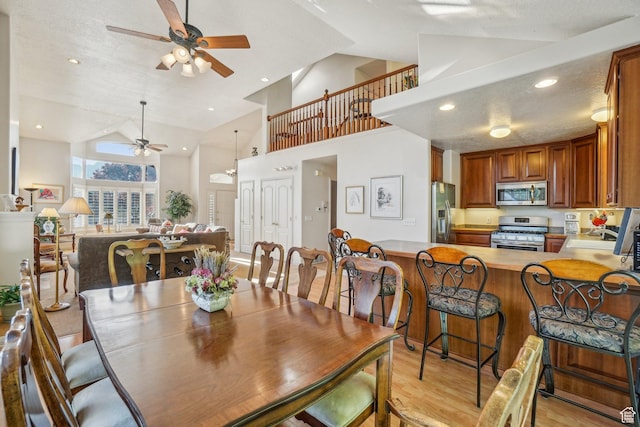4538 Cottage Grove Ln, Murray, UT 84107 - dining space with a ceiling fan, light wood-type flooring, high vaulted ceiling, and recessed lighting