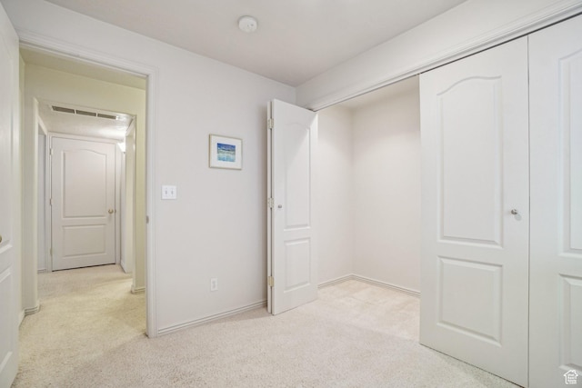 4538 Cottage Grove Ln, Murray, UT 84107 - unfurnished bedroom featuring light carpet, a closet, and baseboards