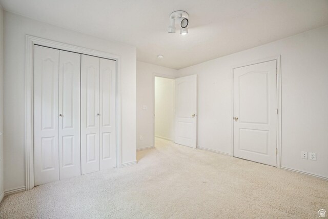 4538 Cottage Grove Ln, Murray, UT 84107 - unfurnished bedroom with carpet floors, baseboards, and a closet