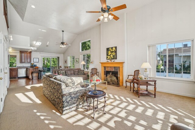 4538 Cottage Grove Ln, Murray, UT 84107 - living area featuring ceiling fan, high vaulted ceiling, a tile fireplace, light carpet, and baseboards