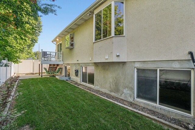 4538 Cottage Grove Ln, Murray, UT 84107 - rear view of house featuring stucco siding, stairs, and a deck