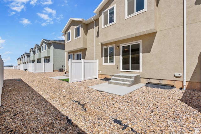 971 N 100 W, Nephi, UT 84648 - back of house featuring stucco siding, a residential view, and a patio area