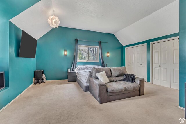 1789 N Stayner Dr W, Farmington, UT 84025 - bedroom featuring two closets, carpet flooring, lofted ceiling, and baseboards
