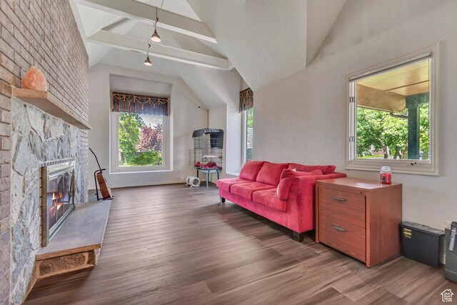 1789 N Stayner Dr W, Farmington, UT 84025 - living area featuring lofted ceiling, wood finished floors, and a fireplace