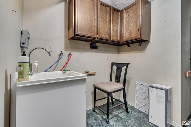 1789 N Stayner Dr W, Farmington, UT 84025 - washroom with baseboards, washer hookup, and cabinet space