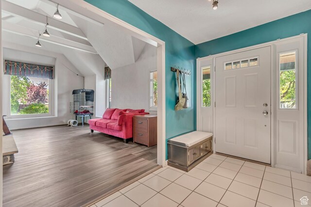 1789 N Stayner Dr W, Farmington, UT 84025 - foyer entrance with track lighting, light wood-type flooring, and lofted ceiling