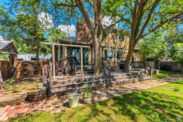 1789 N Stayner Dr W, Farmington, UT 84025 - back of house featuring a wooden deck and a fenced backyard