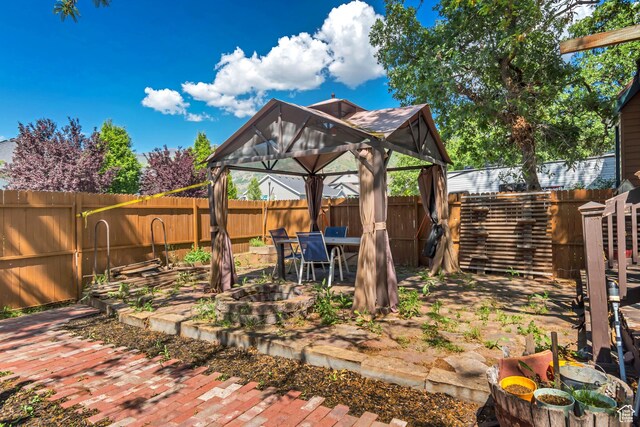 1789 N Stayner Dr W, Farmington, UT 84025 - fenced backyard with a gazebo, a patio, and outdoor dining area