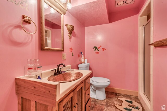 1789 N Stayner Dr W, Farmington, UT 84025 - bathroom with toilet, vanity, a shower with door, and baseboards