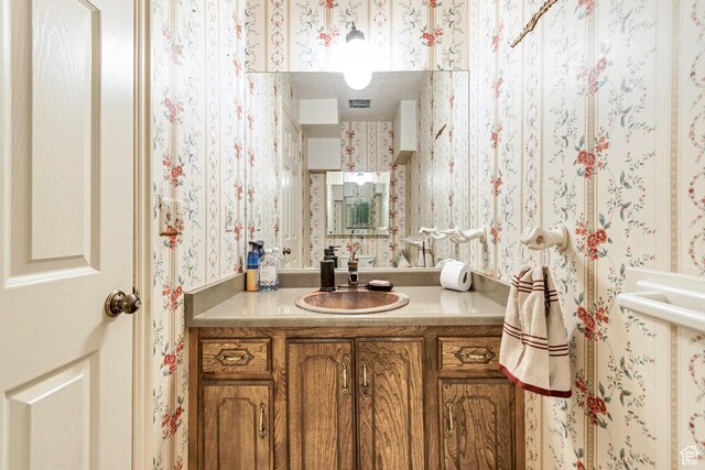 1789 N Stayner Dr W, Farmington, UT 84025 - bathroom with wallpapered walls and vanity
