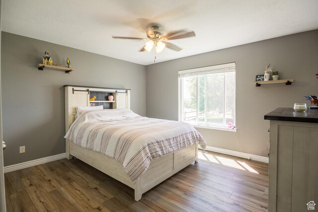 113 E 1500 N, Vernal, UT 84078 - bedroom featuring baseboards, wood finished floors, and a ceiling fan