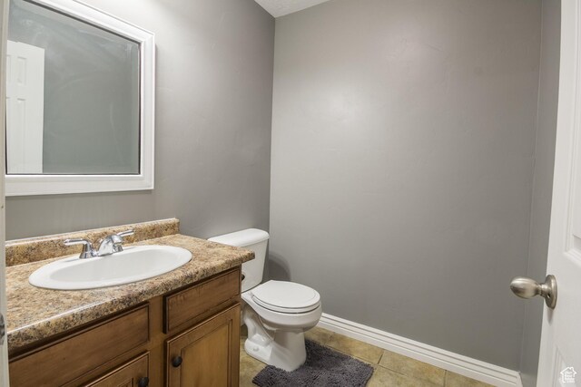 113 E 1500 N, Vernal, UT 84078 - bathroom featuring toilet, vanity, tile patterned flooring, and baseboards