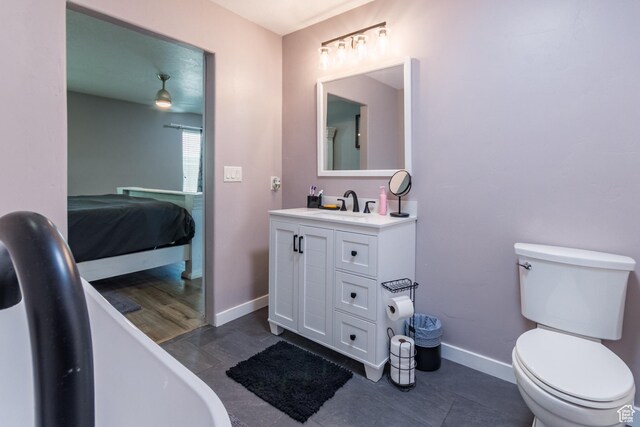 113 E 1500 N, Vernal, UT 84078 - ensuite bathroom with a soaking tub, vanity, toilet, and baseboards
