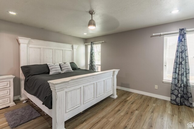 113 E 1500 N, Vernal, UT 84078 - bedroom with light wood finished floors, baseboards, ceiling fan, and recessed lighting