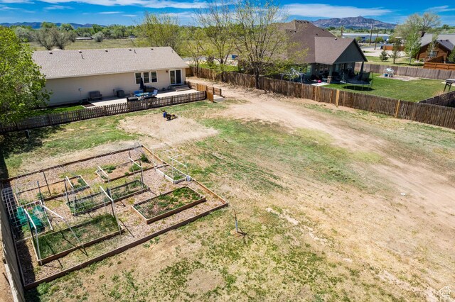 113 E 1500 N, Vernal, UT 84078 - view of yard with a vegetable garden and a deck with mountain view