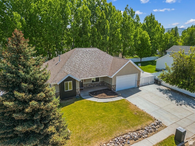 280 N Mill Rd, Heber City, UT 84032 - view of front of property featuring stone siding, concrete driveway, a garage, and roof with shingles